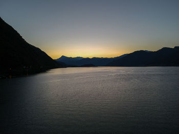 Scenic view of sea against clear sky during sunset