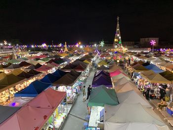 High angle view of illuminated buildings in city at night