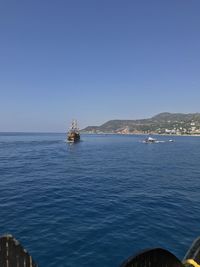 Scenic view of sea against clear blue sky