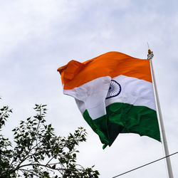 India flag flying high at connaught place with pride in blue sky, india flag fluttering, indian flag