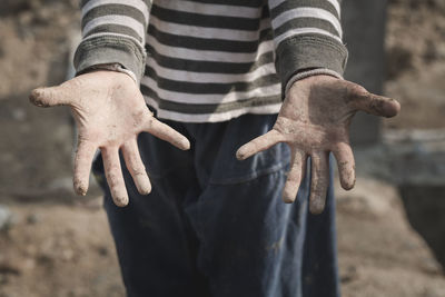 Close-up of man holding hands