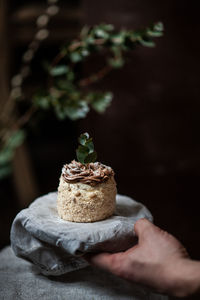 Cropped hand holding dessert