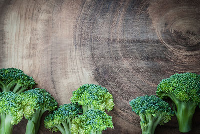 Directly above shot of broccolis on cutting board in kitchen