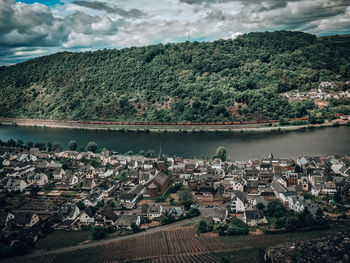 High angle view of river by buildings against sky