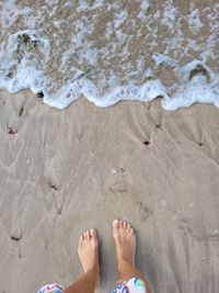 High angle view of woman standing at beach