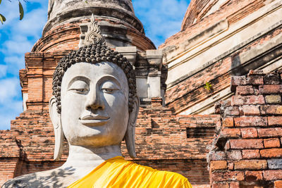 View of statue against historic building