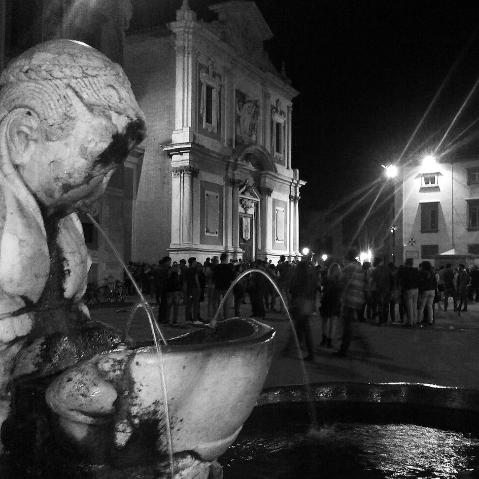 architecture, built structure, building exterior, statue, sculpture, large group of people, fountain, human representation, person, city, men, famous place, art and craft, night, art, illuminated, travel destinations, city life, travel