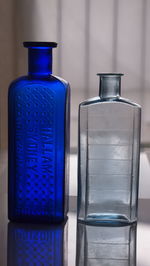 Close-up of glass bottles on table