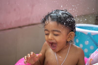 Portrait of girl with swimming pool