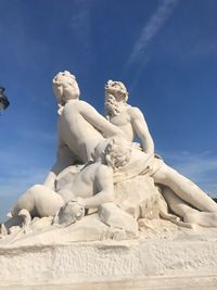 Low angle view of statue against blue sky