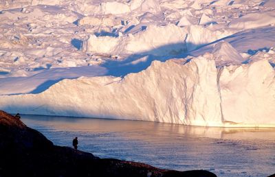 People against river and glaciers