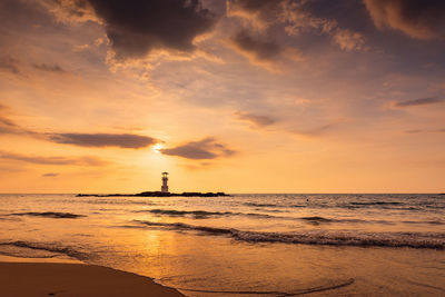 Scenic view of sea against orange sky