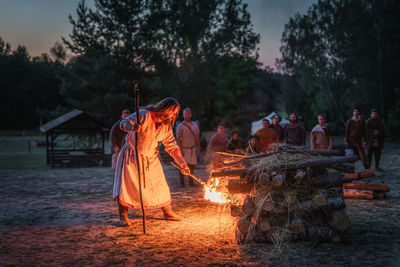 Group of people by bonfire