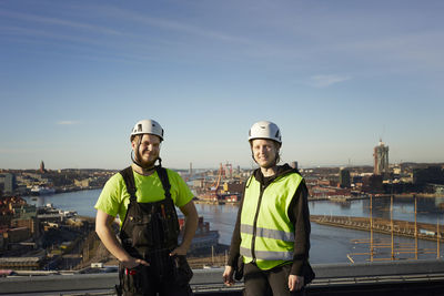 Workers standing on roof