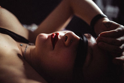 Close-up of woman face in darkroom