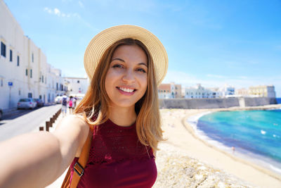 Portrait of smiling young woman in swimming pool