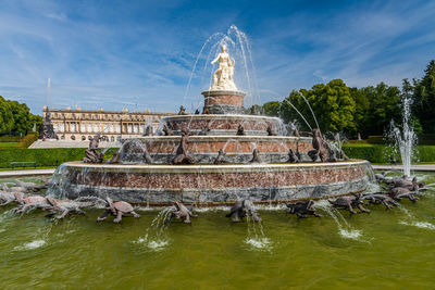 Fountain of latona against cloudy sky