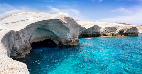 Scenic view of sea against rock formation