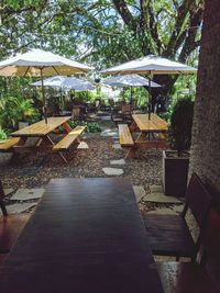 Empty chairs and tables in swimming pool