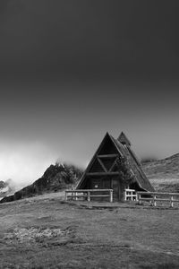 House on field against sky