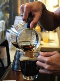 Close-up of pouring tea in cup