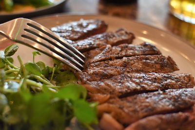 Close-up of meat on barbecue grill