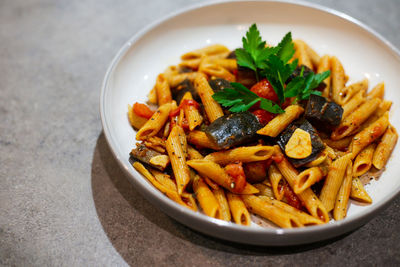 High angle view of pasta in plate on table