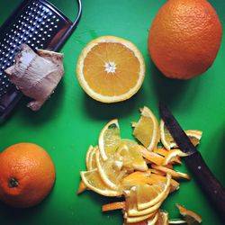 High angle view of orange and ginger on table