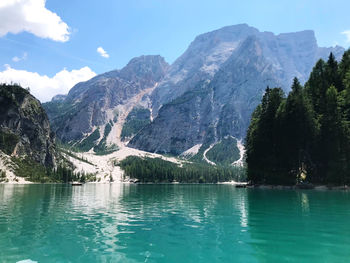 Scenic view of lake and mountains against sky