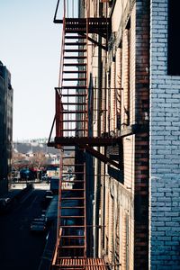 Fire escape against clear sky in city