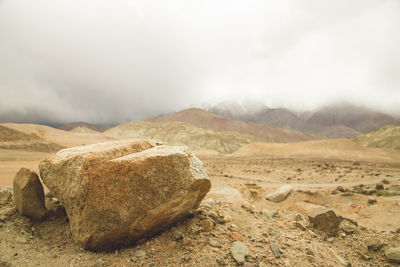 Scenic view of arid landscape against sky