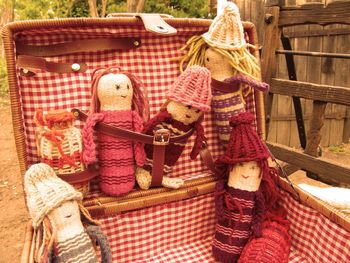 Stuffed toy hanging in basket at market