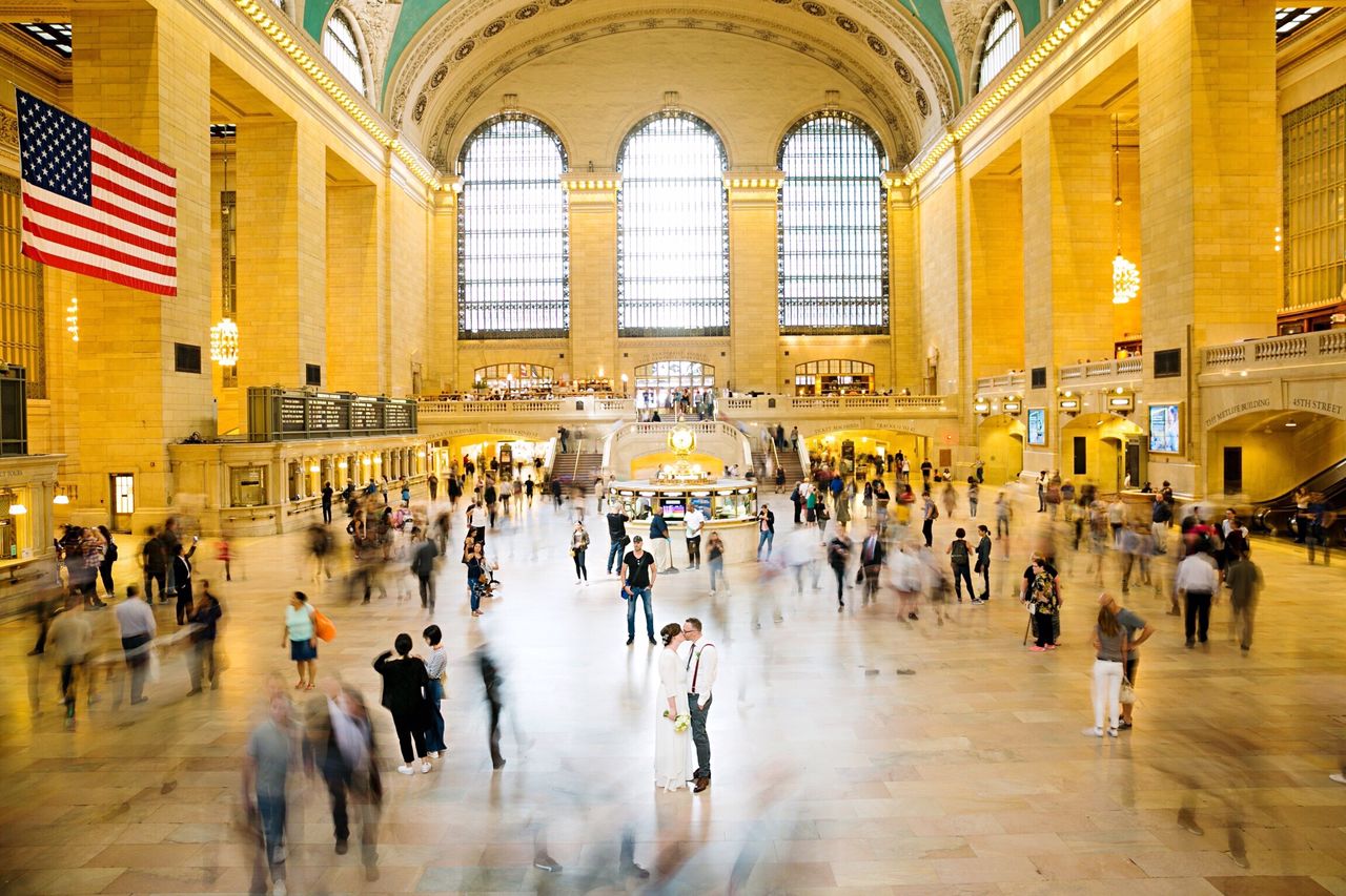 large group of people, architecture, built structure, crowd, travel, indoors, blurred motion, tourism, business travel, walking, commuter, men, motion, lifestyles, people, business, travel destinations, real people, journey, subway station, rush hour, transportation building - type of building, activity, women, businessman, day, city, adult, adults only