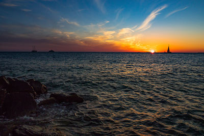 Scenic view of sea against dramatic sky