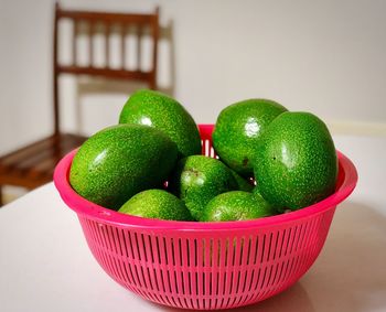 Close-up of fruits in basket on table