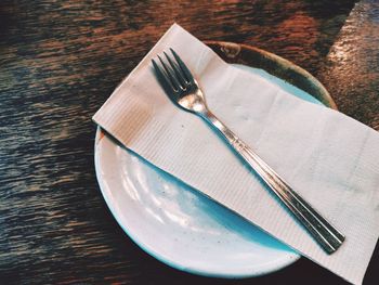 High angle view of tissue paper in plate on table