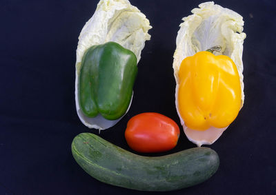 Close-up of bell peppers against black background