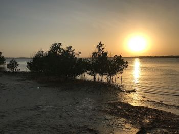 Scenic view of sea against sky at sunset