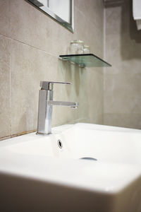 Bathroom interior with sink and faucet.