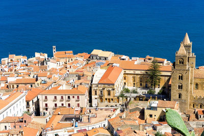 High angle view of townscape by sea