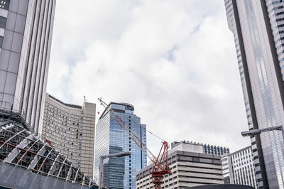 Low angle view of modern buildings against sky