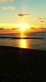 Scenic view of sea at sunset