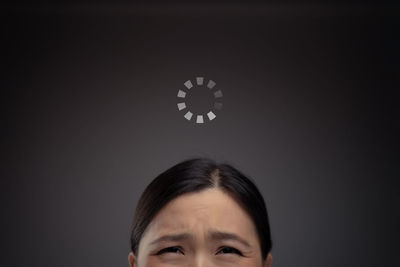 Portrait of man against black background