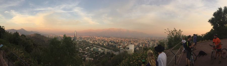 High angle view of city buildings against sky during sunset