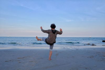 Woman standing on beach