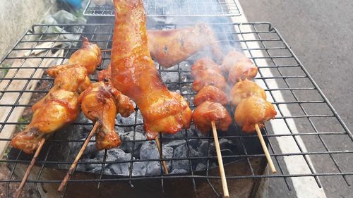 Close-up of meat on barbecue grill