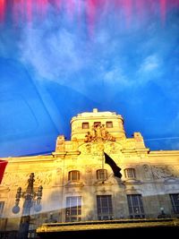 Low angle view of built structure against blue sky