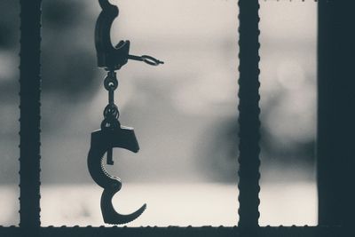 Close-up of chain hanging on metal