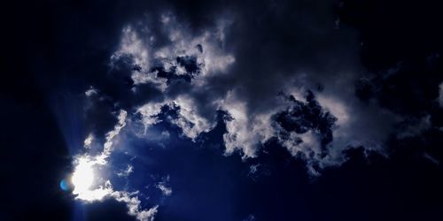 Low angle view of clouds in sky at night