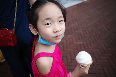 Portrait of cute girl holding ice cream